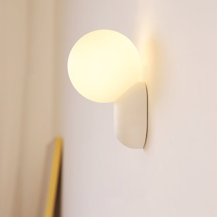 Glass Globe Wall Lamp With Resin Base For Elegant Home Interiors