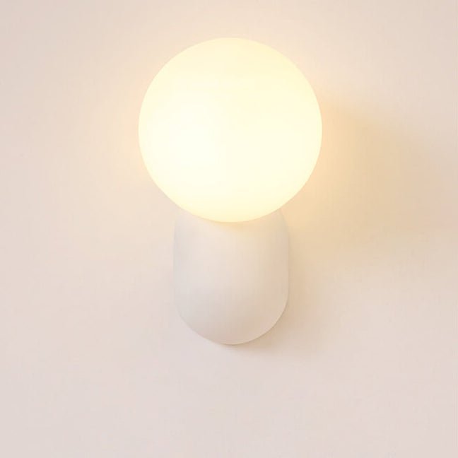 Glass Globe Wall Lamp With Resin Base For Elegant Home Interiors