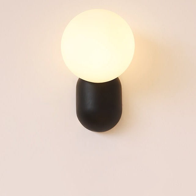 Glass Globe Wall Lamp With Resin Base For Elegant Home Interiors
