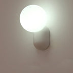 Glass Globe Wall Lamp With Resin Base For Elegant Home Interiors