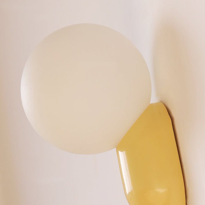 Glass Globe Wall Lamp With Resin Base For Elegant Home Interiors