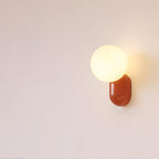 Glass Globe Wall Lamp With Resin Base For Elegant Home Interiors