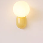Glass Globe Wall Lamp With Resin Base For Elegant Home Interiors